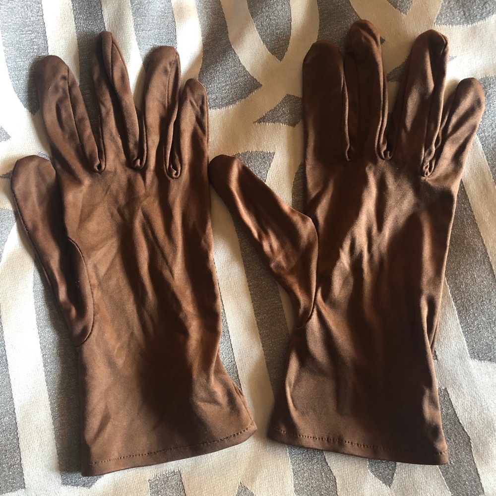 Jewelry and exotic handbag showing gloves